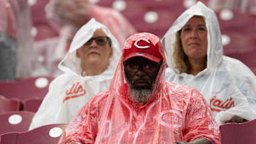 Fans sit in the stands during a rain delay