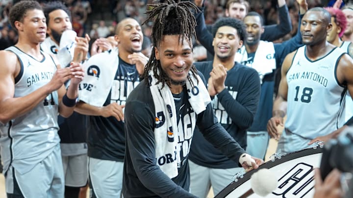 Feb 7, 2026; San Antonio, Texas, USA;  San Antonio Spurs guard Stephon Castle (5) beats the drum after the game against the Dallas Mavericks at Frost Bank Center. Mandatory Credit: Daniel Dunn-Imagn Images