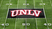 The UNLV Rebels logo at midfield during the Mountain West Championship at Allegiant Stadium. Mandatory Credit: Kirby Lee-Imagn Images