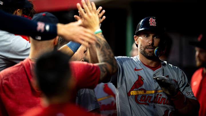 St. Louis Cardinals first baseman Paul Goldschmidt (46) high fives his teammates after scoring off a base hit in the ninth inning of the MLB baseball game between the Cincinnati Reds and the St. Louis Cardinals at Great American Ball Park in Cincinnati on Tuesday, May 28, 2024.