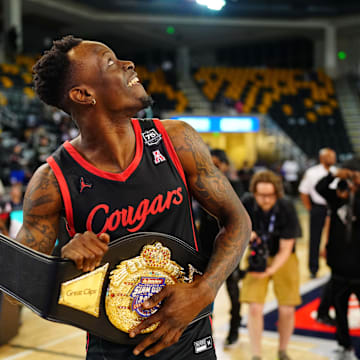 Mar 31, 2022; New Orleans, LA, USA; Houston Cougars Guard Taze Moore (4) celebrates after winning at Convocation Center. Mandatory Credit: Andrew Wevers-Imagn Images