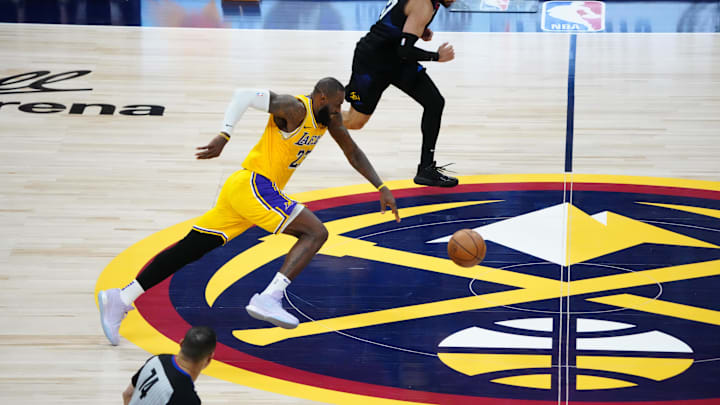 Apr 22, 2024; Denver, Colorado, USA; Los Angeles Lakers forward LeBron James (23) and Denver Nuggets guard Jamal Murray (27) in the fourth quarter during game two during the 2024 NBA playoffs at Ball Arena. Mandatory Credit: Ron Chenoy-Imagn Images