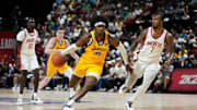 Jul 12, 2024; Las Vegas, NV, USA; Los Angeles Lakers forward Blake Hinson (36) drives the ball against Houston Rockets forward Cam Whitmore (7) during the second half at Thomas & Mack Center. Mandatory Credit: Lucas Peltier-Imagn Images