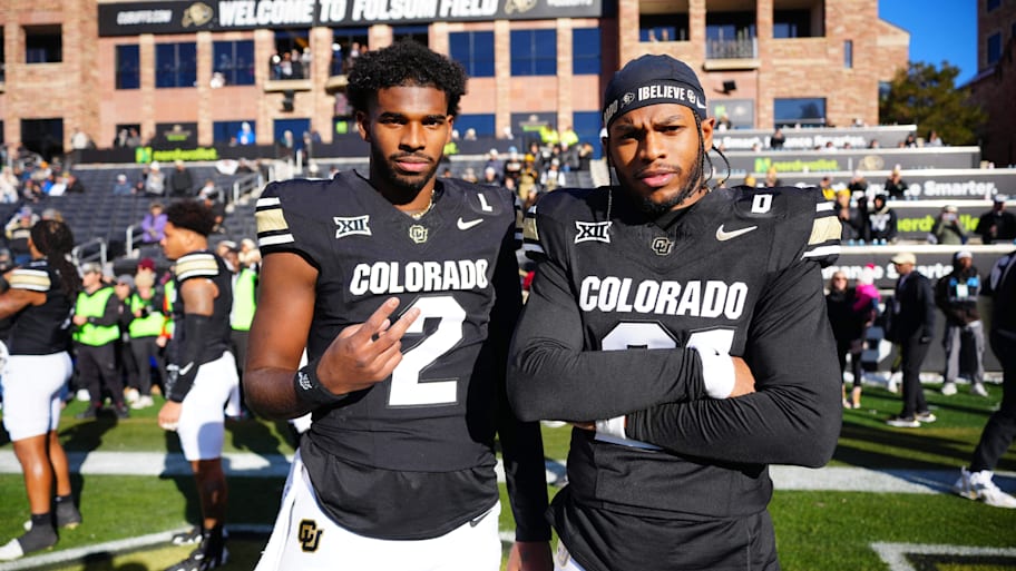 Nov 29, 2024; Boulder, Colorado, USA; Colorado Buffaloes quarterback Shedeur Sanders (2) and safety Shilo Sanders (21) pose for a photo before the game against the Oklahoma State Cowboys at Folsom Field. Mandatory Credit: Ron Chenoy-Imagn Images | Ron Chenoy-Imagn Images