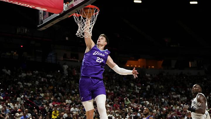 Jul 14, 2025; Las Vegas, NV, USA;  Utah Jazz forward Kyle Filipowski (22) dunks the ball against the San Antonio Spurs during the first half of a NBA basketball game at the Thomas & Mack Center. Mandatory Credit: Lucas Peltier-Imagn Images