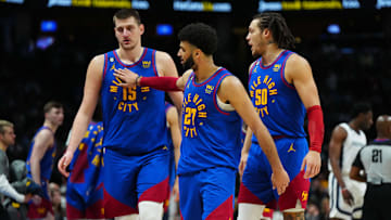 Mar 3, 2023; Denver, Colorado, USA; Denver Nuggets center Nikola Jokic (15) and guard Jamal Murray (27) and forward Aaron Gordon (50) celebrate after defeating the Memphis Grizzlies at Ball Arena. Mandatory Credit: Ron Chenoy-USA TODAY Sports
