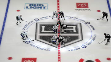 Dec 30, 2021; Los Angeles, California, USA; A general overall view of opening faceoff as referee Garrett Rank (7) drops the puck between Vancouver Canucks center Bo Horvat (53) and LA Kings center Blake Lizotte (46) at Crypto.com Arena. Mandatory Credit: Kirby Lee-Imagn Images