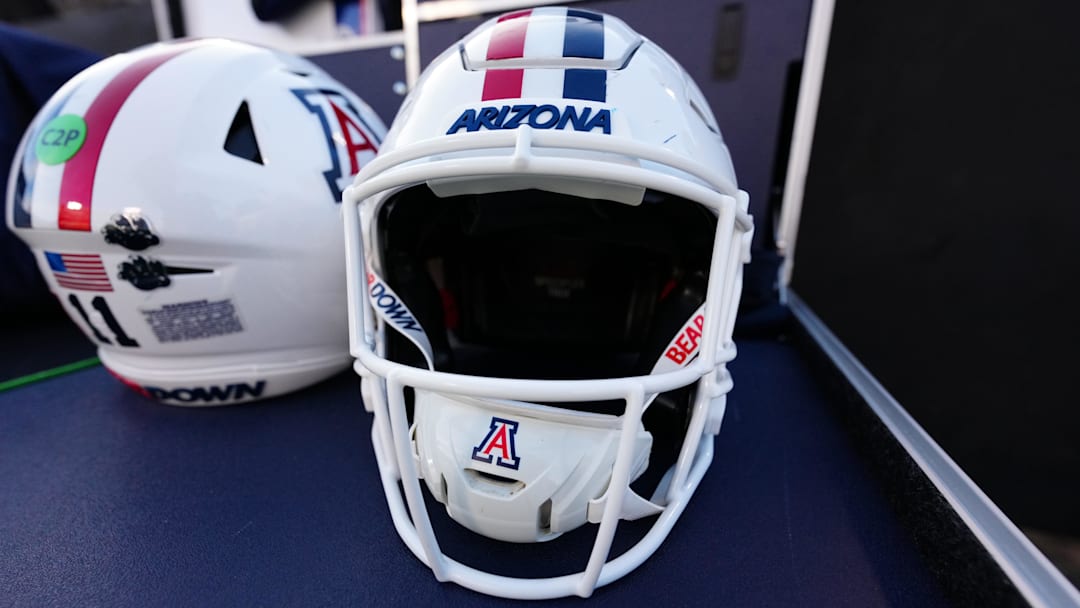 Nov 1, 2025; Boulder, Colorado, USA; General view of Arizona Wildcats helmets before the game against the Colorado Buffaloes at Folsom Field. Mandatory Credit: Ron Chenoy-Imagn Images