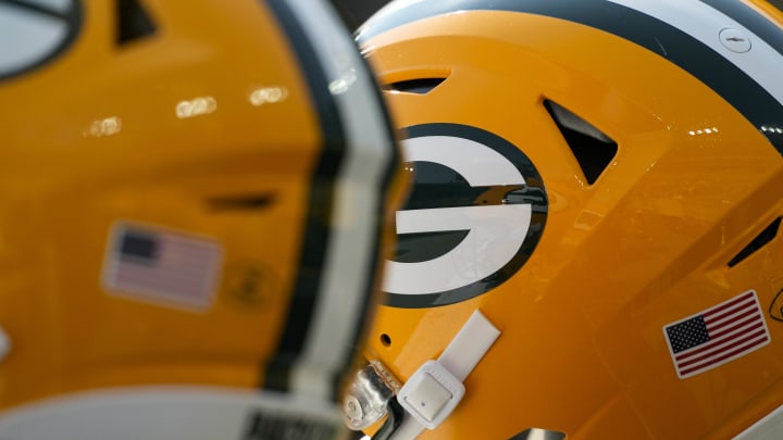 Aug 24, 2024; Green Bay, Wisconsin, USA;  General view of Green Bay Packers helmets during warmups prior to the game against the Baltimore Ravens at Lambeau Field. Mandatory Credit: Jeff Hanisch-USA TODAY Sports