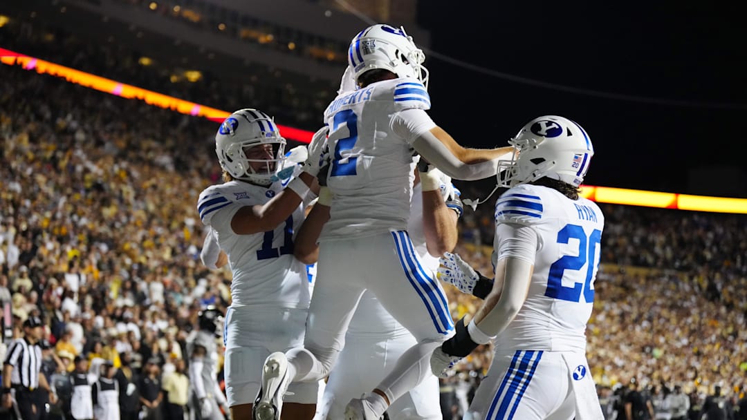Sep 27, 2025; Boulder, Colorado, USA; Brigham Young Cougars wide receiver Chase Roberts (2) celebrates his touchdown reception in the third quarter against the Colorado Buffaloes at Folsom Field. Mandatory Credit: Ron Chenoy-Imagn Images
