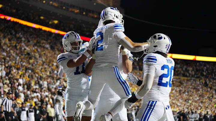 Sep 27, 2025; Boulder, Colorado, USA; Brigham Young Cougars wide receiver Chase Roberts (2) celebrates his touchdown reception in the third quarter against the Colorado Buffaloes at Folsom Field. Mandatory Credit: Ron Chenoy-Imagn Images