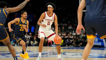 Mar 12, 2025; Charlotte, NC, USA; Stanford Cardinal guard Ryan Agarwal (11) with the ball as California Golden Bears guard Christian Tucker (22) defends in the first half at Spectrum Center. Mandatory Credit: Bob Donnan-Imagn Images