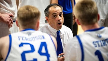 Drake head coach Ben McCollum talks with his team during a second half timeout on Monday, Nov. 4, 2024, at the Knapp Center.