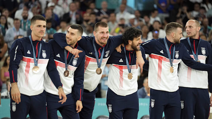 Serbia center Nikola Jokic (15) celebrates on the podium with teammates after winning the bronze medal in men's basketball during the Paris 2024 Olympic Summer Games at Accor Arena. 