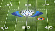 The Pac-12 Conference logo at midfield at Allegiant Stadium. 