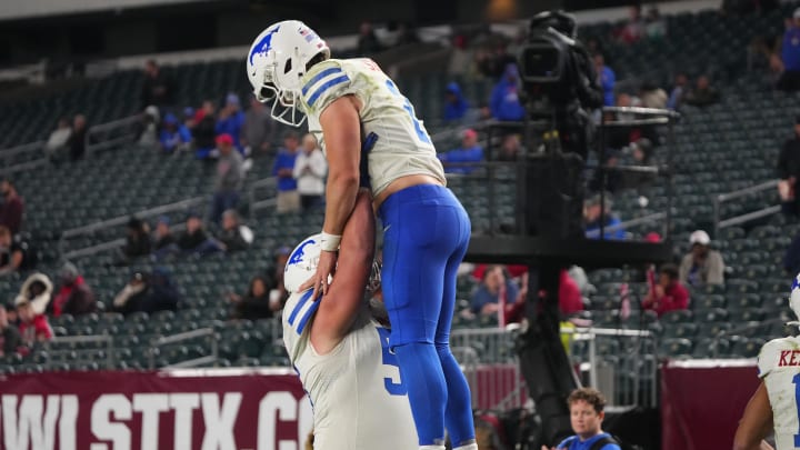 Oct 20, 2023; Philadelphia, Pennsylvania, USA; SMU Mustangs wide receiver Moochie Dixon (5) lifts SMU Mustangs quarterback Preston Stone (2) to celebrate his touchdown against the Temple Owls during the second half at Lincoln Financial Field. Mandatory Credit: Gregory Fisher-USA TODAY Sports