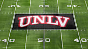 The UNLV Rebels logo at midfield during the Mountain West Championship at Allegiant Stadium. Mandatory Credit: Kirby Lee-Imagn Images