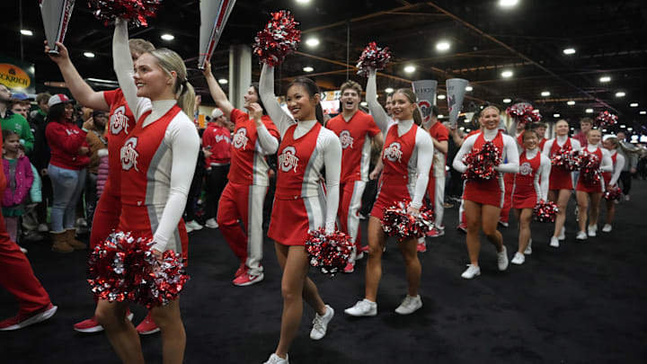 The Ohio State Buckeyes cheerleaders at the College Football Playoff Fan Central at the Georgia World Congress Center. 