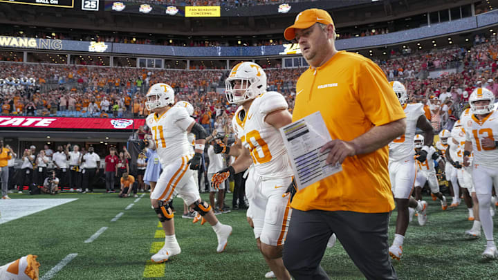 Sep 7, 2024; Charlotte, North Carolina, USA; Tennessee Volunteers head coach Josh Heupel heads onto the field during the first quarter against the North Carolina State Wolfpack at the Dukes Mayo Classic at Bank of America Stadium. Mandatory Credit: Jim Dedmon-Imagn Images