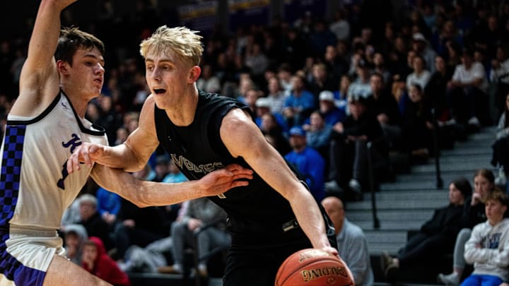 Northwest’s Colin Rice (4) drives past his defender, Waukee’s Pete Craig (1), on Feb. 3, 2026, at Waukee High School.