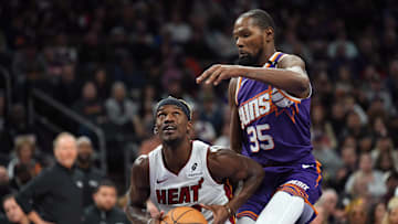 Nov 6, 2024; Phoenix, Arizona, USA; Miami Heat forward Jimmy Butler (22) drives against Phoenix Suns forward Kevin Durant (35) during the second half at Footprint Center. Mandatory Credit: Joe Camporeale-Imagn Images