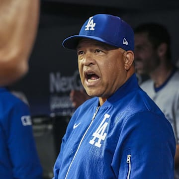 May 3, 2025; Cumberland, Georgia, USA; Los Angeles Dodgers manager Dave Roberts (30) reacts in the dugout against the Atlanta Braves during the second inning at Truist Park. Mandatory Credit: Dale Zanine-Imagn Images