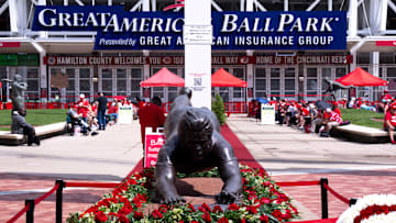 Roses are placed around the Pete Rose statue outside Great American Ball Park