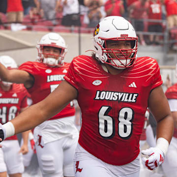 Louisville Cardinals take the field ahead of their game against the Austin Peay Governors on Saturday, Aug. 31, 2024 at L&N Federal Credit Union Stadium in Louisville, Ky.