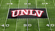 The UNLV Rebels logo at midfield during the Mountain West Championship at Allegiant Stadium. Mandatory Credit: Kirby Lee-Imagn Images