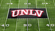 The UNLV Rebels logo at midfield during the Mountain West Championship at Allegiant Stadium. Mandatory Credit: Kirby Lee-Imagn Images