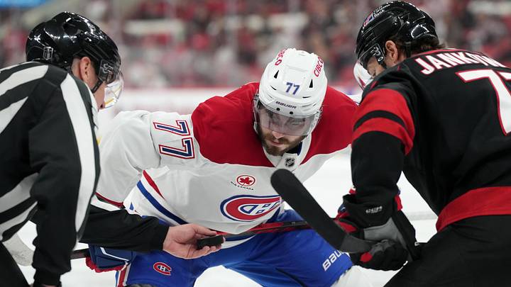 May 29, 2026; Raleigh, North Carolina, USA; Montreal Canadiens center Kirby Dach (77) prepares for a faceoff against Carolina Hurricanes left wing Mark Jankowski (77) in game five of the Eastern Conference Final of the 2026 Stanley Cup Playoffs during the second period at Lenovo Center. Mandatory Credit: James Guillory-Imagn Images