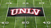 Dec 2, 2023; Las Vegas, NV, USA; The UNLV Rebels logo at midfield during the Mountain West Championship at Allegiant Stadium. Mandatory Credit: Kirby Lee-Imagn Images