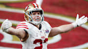 San Francisco 49ers running back Christian McCaffrey (23) celebrates after scoring a touchdown against the Kansas City Chiefs in the first half in Super Bowl LVIII at Allegiant Stadium. 