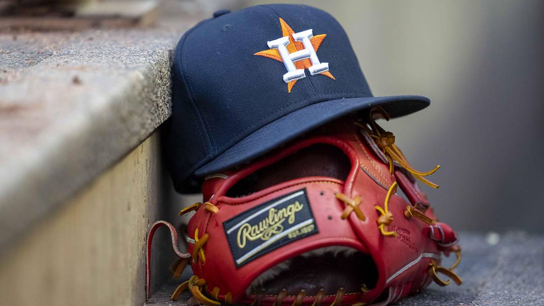 A general view of a Houston Astros hat and glove in the dugout during the fifth inning against the Minnesota Twins at Target Field. 