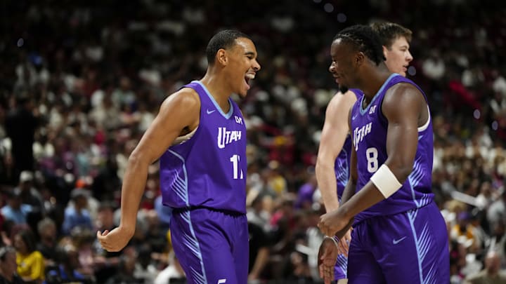 Jul 14, 2025; Las Vegas, NV, USA; Utah Jazz forward John Tonje (17) celebrates with guard Isaiah Collier (8) after scoring against the San Antonio Spurs during the second half of a NBA basketball game at the Thomas & Mack Center. Mandatory Credit: Lucas Peltier-Imagn Images