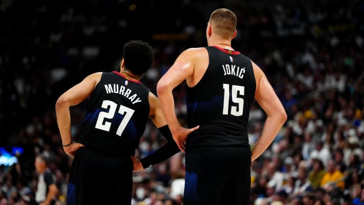 May 19, 2024; Denver, Colorado, USA; Denver Nuggets guard Jamal Murray (27) and center Nikola Jokic (15) during the first half against the Minnesota Timberwolves during game seven of the second round for the 2024 NBA playoffs at Ball Arena. Mandatory Credit: Ron Chenoy-USA TODAY Sports