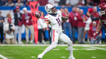 Dec 28, 2023; San Antonio, TX, USA;  Arizona Wildcats quarterback Noah Fifita (11) throws a pass in the first half against the Oklahoma Sooners at Alamodome.