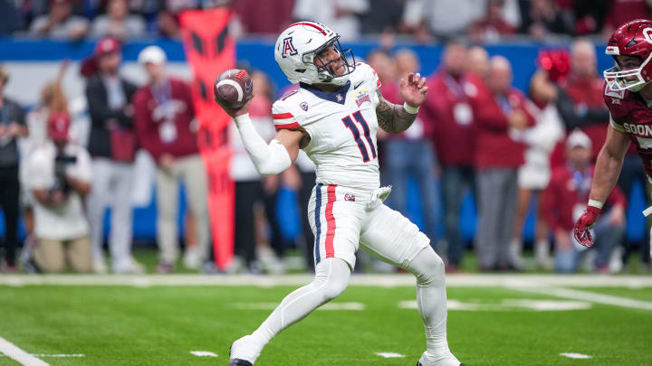 Dec 28, 2023; San Antonio, TX, USA;  Arizona Wildcats quarterback Noah Fifita (11) throws a pass in the first half against the Oklahoma Sooners at Alamodome.