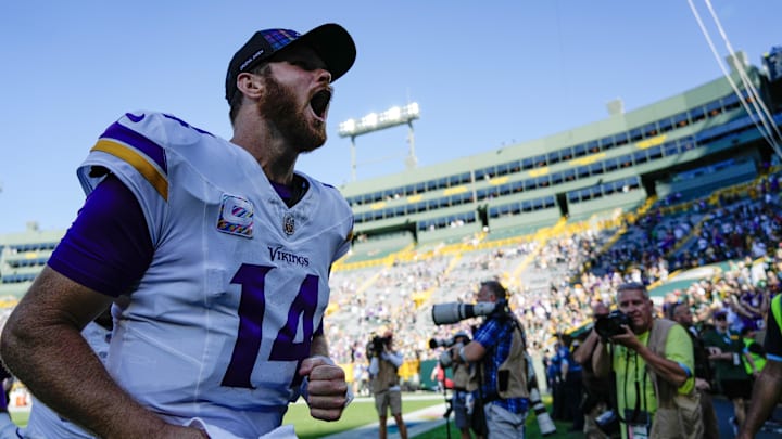 Darnold cheers as he leaves Lambeau following the win over the Packers