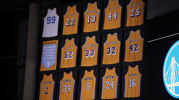 May 8, 2023; Los Angeles, California, USA; The Los Angeles Lakers retired jereys of Kareem Abdul-Jabbar (33), Elgin Baylor (22), Kobe Bryant (8 and 24), Pau Gasol (16), Gail Goodrich (25), Magic Johnson (32), Shaquille O'Neal (34), jerry West (44), Jamaal Wilkes (52), James Worthy (42), George Mikan (99) and Chick Hearn during game four of the 2023 NBA playoffs at Crypto.com Arena. Mandatory Credit: Kirby Lee-Imagn Images