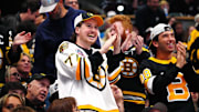 Oct 16, 2024; Denver, Colorado, USA; Boston Bruins fans celebrate a goal scored in the second period against the Colorado Avalanche at Ball Arena. Mandatory Credit: Ron Chenoy-Imagn Images