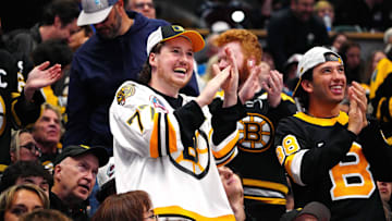 Oct 16, 2024; Denver, Colorado, USA; Boston Bruins fans celebrate a goal scored in the second period against the Colorado Avalanche at Ball Arena. Mandatory Credit: Ron Chenoy-Imagn Images