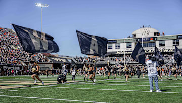 Oct 12, 2024; Winston-Salem, North Carolina, USA; Wake Forest Demon Deacons cheerleaders lead their team onto the field during the first half against the Clemson Tigers at Allegacy Federal Credit Union Stadium. Mandatory Credit: Jim Dedmon-Imagn Images