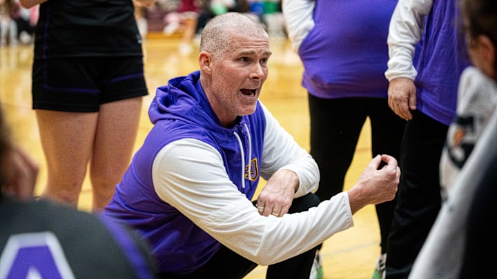 Johnston head coach Chad Jilek talks with his players during a timeout on Friday, Jan. 24, 2025, at Dowling Catholic High School.