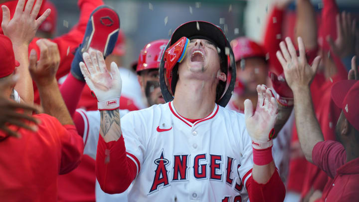 Jul 10, 2024; Anaheim, California, USA;  Los Angeles Angels center fielder Mickey Moniak (16) celebrates with teammates after hitting a three-run home run in the second inning against the Texas Rangers at Angel Stadium. Mandatory Credit: Kirby Lee-USA TODAY Sports