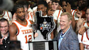Jan 25, 2025; Austin, Texas, USA; Texas Longhorns guard Tramon Mark (12) holds the Lone Star Showdown trophy after a victory over the Texas A&M Aggies at Moody Center. Mandatory Credit: Scott Wachter-Imagn Images