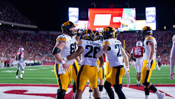 Oct 11, 2025; Madison, Wisconsin, USA; Iowa Hawkeyes running back Xavier Williams (26) celebrates a touchdown with his teammates in the second half against the Wisconsin Badgers at Camp Randall Stadium. Mandatory Credit: Ross Harried-Imagn Images