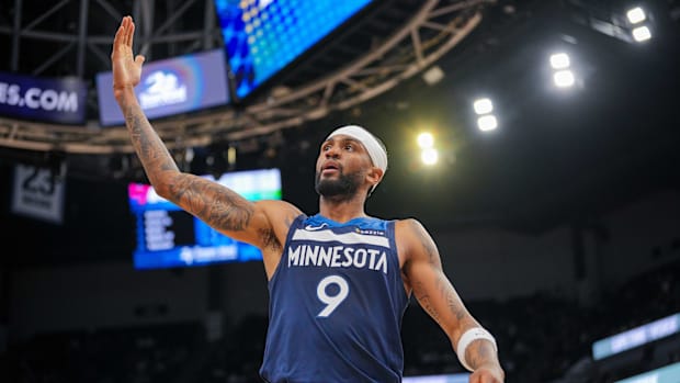 Minnesota Timberwolves guard Nickeil Alexander-Walker (9) signals the crowd against the Philadelphia 76ers 