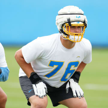 Los Angeles Chargers tackle Joe Alt (76) wears a Guardian helmet cap during organized team activities at the Hoag Performance Center. Mandatory Credit: Kirby Lee-USA TODAY Sports
