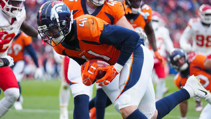 Oct 29, 2023; Denver, Colorado, USA; Denver Broncos linebacker Drew Sanders (41) advances a fumble recovery in the fourth quarter against the Kansas City Chiefs at Empower Field at Mile High. Mandatory Credit: Ron Chenoy-USA TODAY Sports